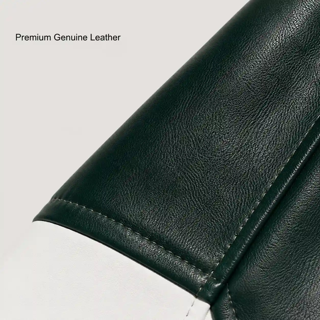 Close-up of a dark green genuine leather material swatch with visible grain texture and stitching, on a light gray background with the text 'Premium Genuine Leather' in the top left.