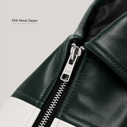 Close-up of a dark green leather jacket with a white contrast panel and a silver YKK metal zipper, featuring a text overlay 'YKK Metal Zipper' on a light gray background.